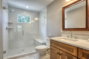 A newly remodeled luxury bathroom with a walk-in shower