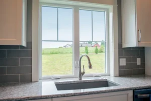 A new kitchen sink and view out a window